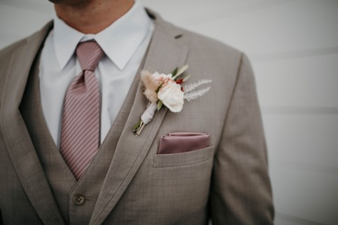 close up of tuxedo with floral decoration and handkerchief