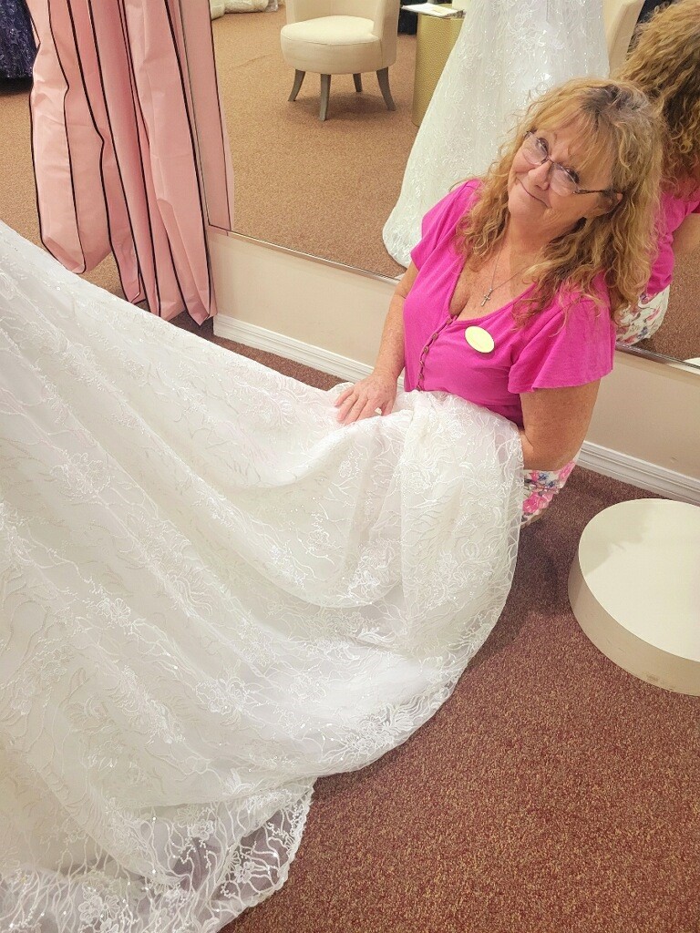 professional alterations worked on by a bridal seamstress on a beautiful wedding dress at Aurora Bridal in Mims, FL
