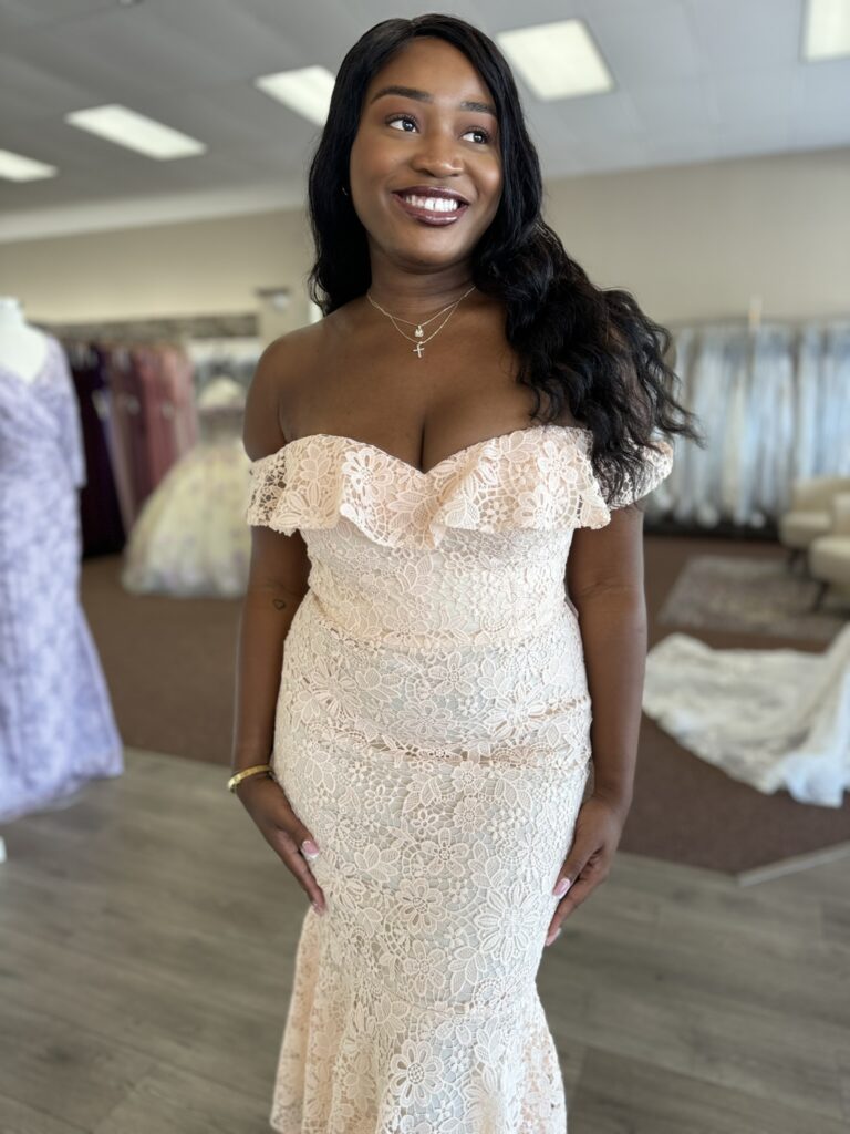 Bridesmaid wearing a vibrant dress in a Florida-based bridal boutique