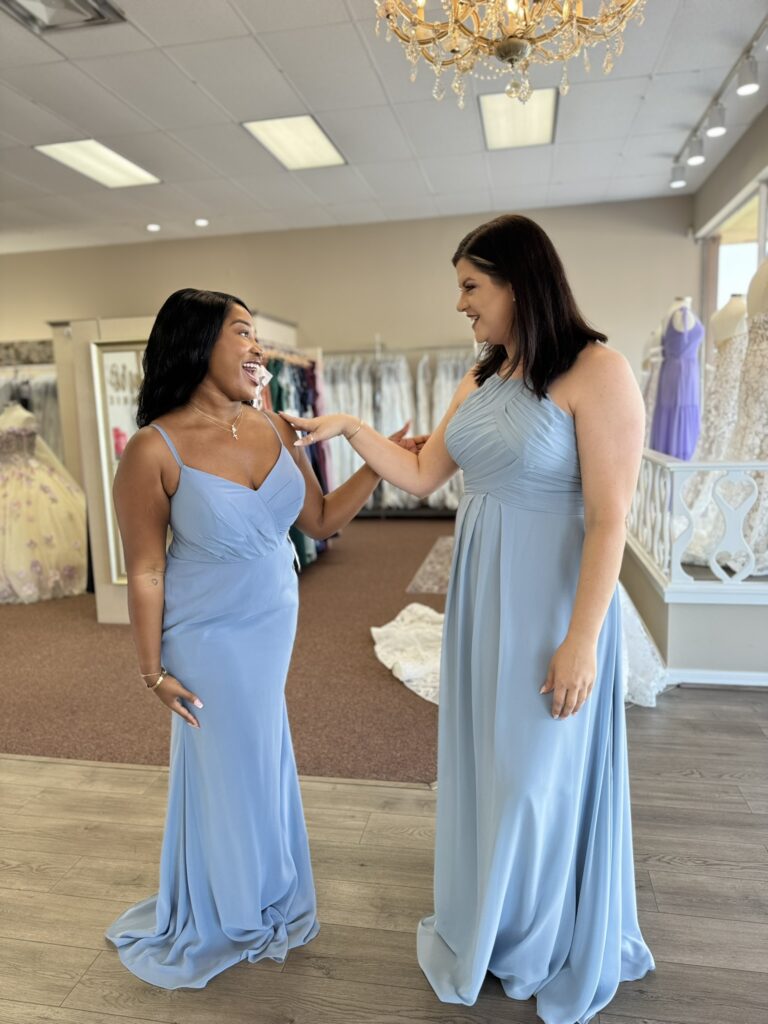 Bride's friend models a colorful gown in a wedding shop in Palm Bay, Florida