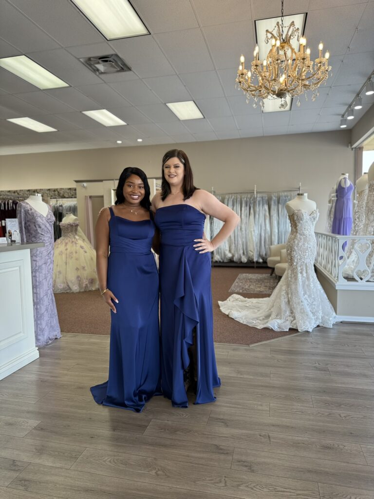 Women showcasing colorful bridesmaid dresses at a Florida wedding store