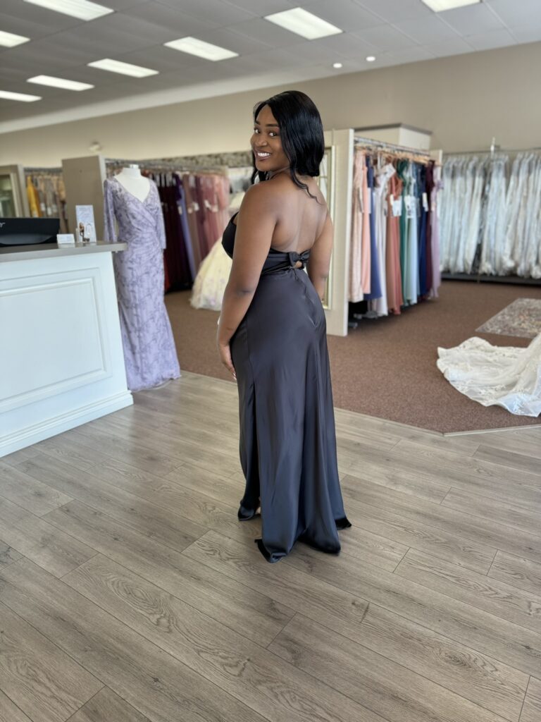 Florida wedding boutique featuring a woman in a dark bridesmaid gown