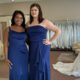 Women showcasing blue bridesmaid dresses at a Florida wedding store