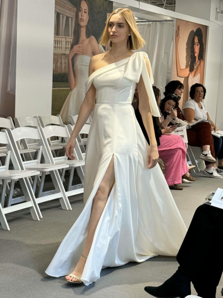 bride modeling a wedding bow dress at Aurora Bridal in Melbourne, FL