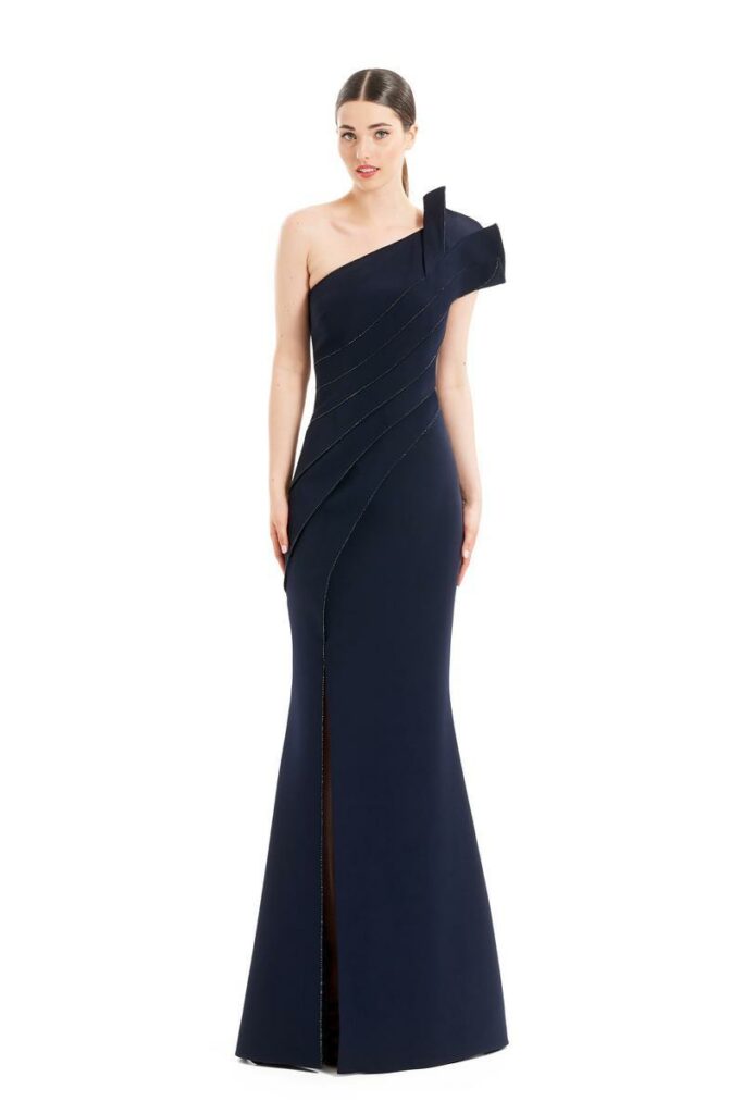 a woman wearing a simple, sleek navy blue mother of the bride gown