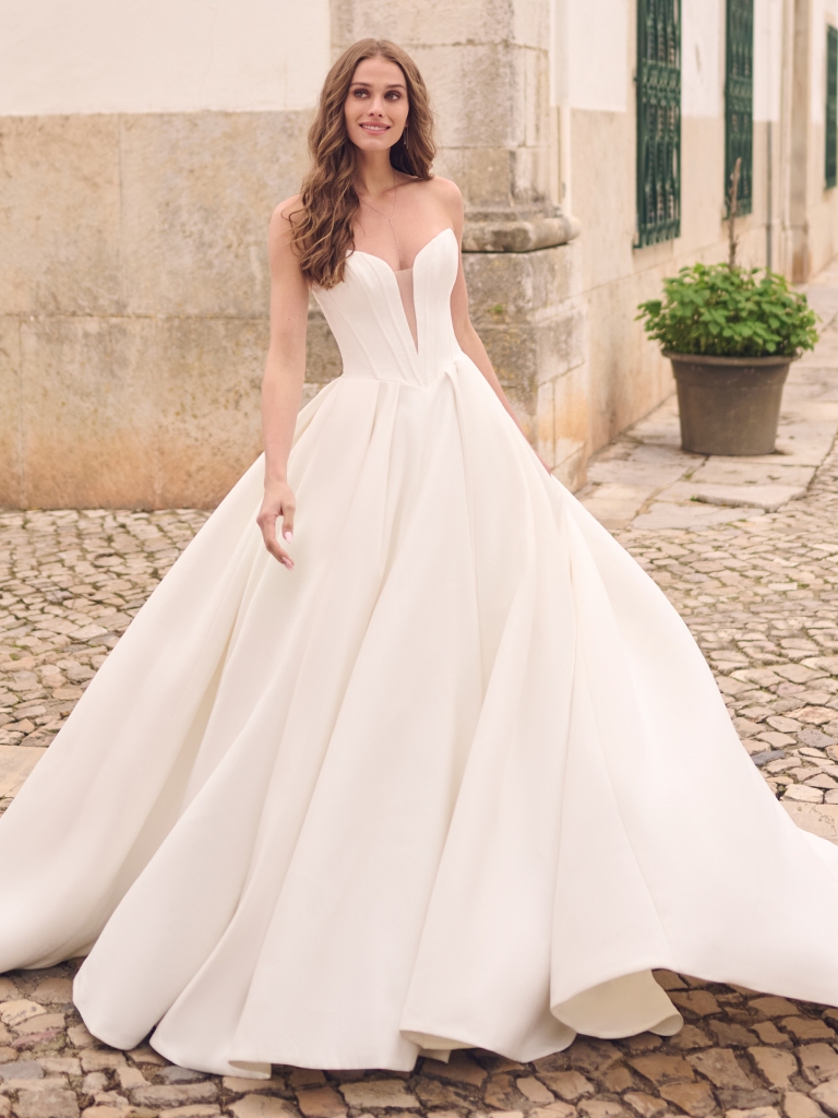 Smiling bride wearing a white ballgown