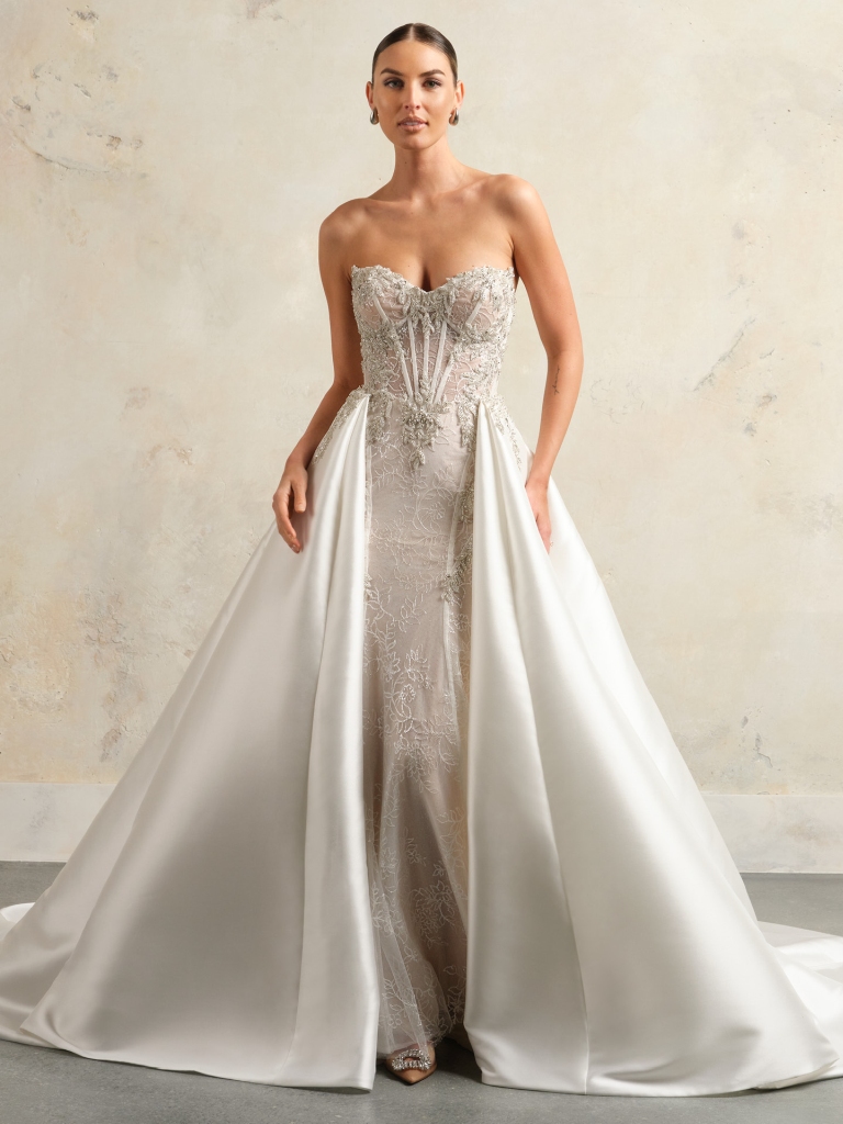 a stunning wedding dress with a sweetheart neckline and a detachable train