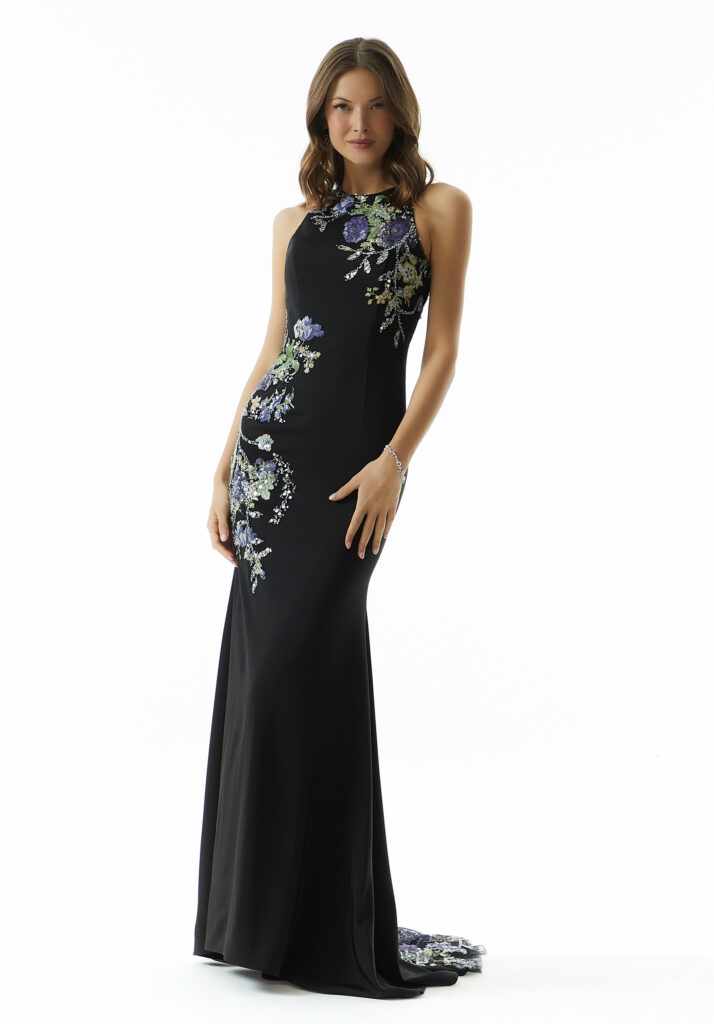 Elegant black gown with detailed floral embroidery on sheer fabric, perfect for galas.