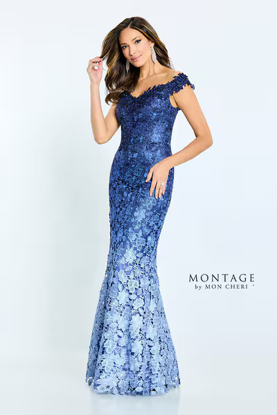 Model in a striking blue floral gown with a high slit, ideal for elegant events such as weddings.