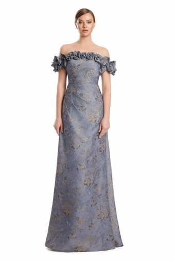 Woman modeling a blue-gray off-the-shoulder evening gown with textured floral fabric and a straight floor-length skirt.